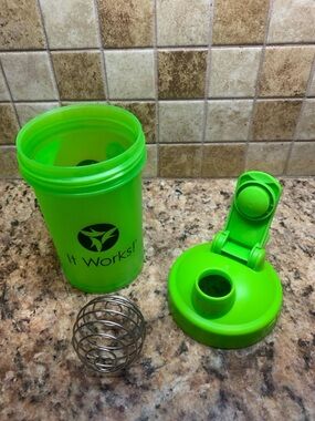 Green BlenderBottle Classic V2 shaker bottle with a flip-top lid & carry loop.